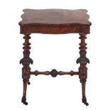 A Victorian serpentine walnut work table, the lid in figured veneers and lifting to reveal a