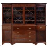 An Edwardian mahogany breakfront secretaire-bookcase, with dentil cornice and fitted with adjustable