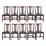 A set of six George III oak dining chairs and a set of four similar mahogany chairs, matching blue