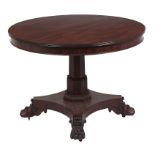 A William IV mahogany breakfast table, the figured round tip up top on stepped octagonal pillar,
