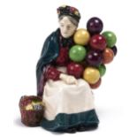 A Royal Doulton earthenware figure of the Old Balloon Seller, 1932, 18.5cm h, impressed date,