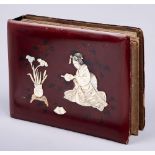 A Japanese photograph album, early 20th c, with carved bone and mother of pearl decorated lacquer
