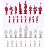 A Chinese export ivory chess set, mid 19th c, each piece in the form of a figure, the rooks as an