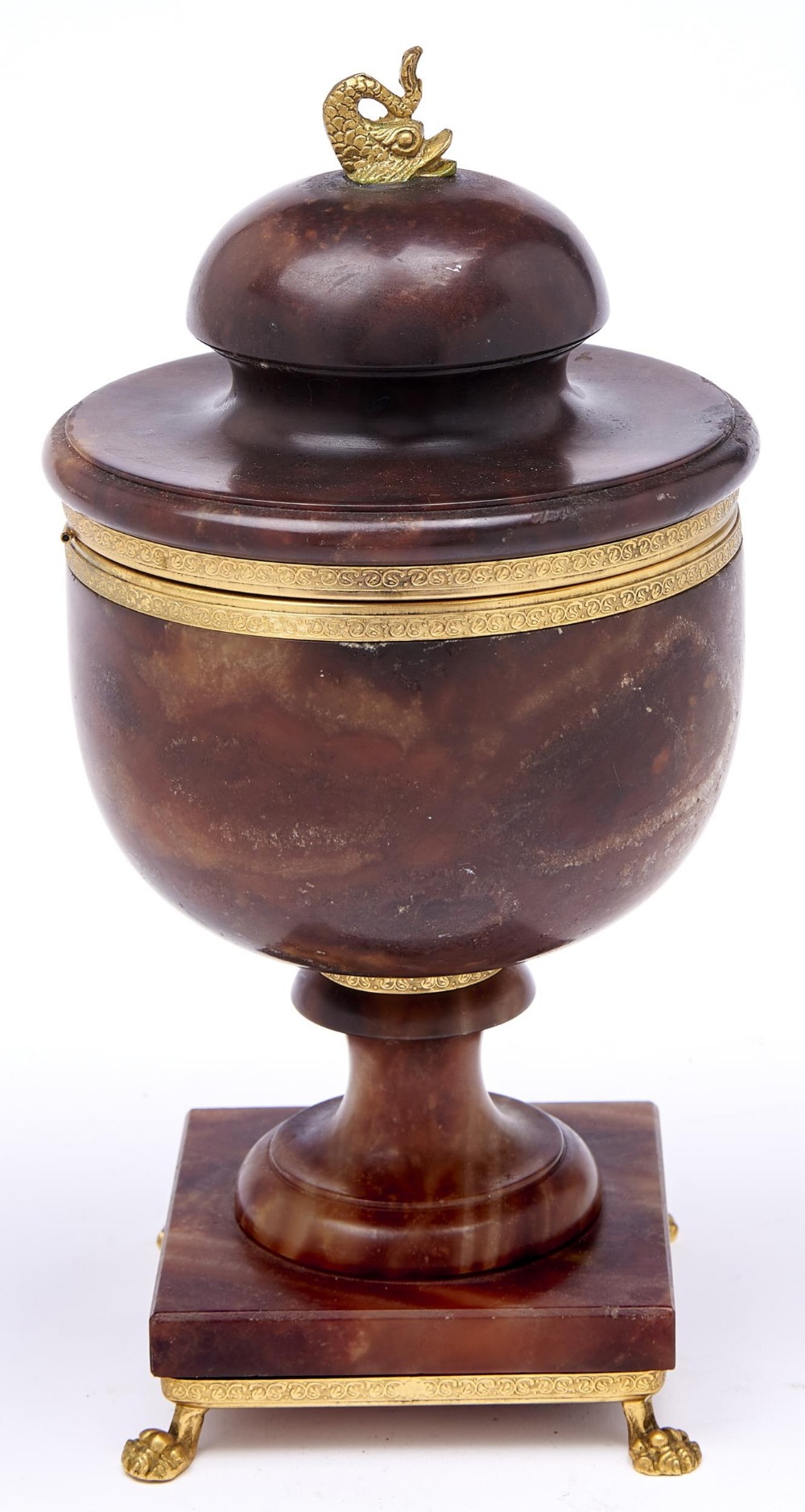 A giltmetal mounted stained alabaster lidded urn, 20th c,  with dolphin finial and paw feet, 28cm