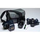 A Minolta 7000 35mm SLR camera, with maker's F4 55-70mm AF lens and F4 75-110mm AF lens