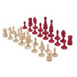 A Victorian bone chess set, stained red and natural, kings 95mm h Three knight's ears slightly