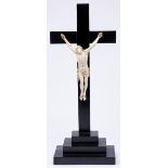 A Dieppe ivory Corpus Christi, 19th c,  on ebonised cross, 23.5cm h, cross 55.5cm h Ivory with old