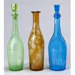 A Victorian blue glass perpendicular cylinder decanter and stopper and two amber flashed or green