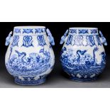 Two Chinese blue and white wine vessels, Hu, with deer's head handles, painted with dragons in a
