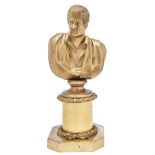 A Victorian gilt lacquered brass bust of Lord Byron, on wreathed pedestal with cut cornered base,
