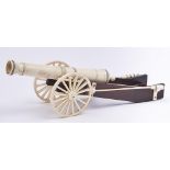 A Victorian bone, ivory and mahogany model of a field gun, c1900, 29cm overall Old repair to barrel