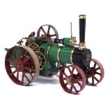 A scratch built brass and ferrous metal model traction engine, painted green, black and red, overall