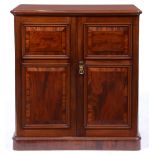 A Victorian mahogany plate cupboard, the interior baize lined, enclosed by a pair of doors with