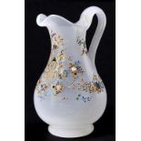 A French or Bohemian enamelled opalescent glass jug, mid 19th c, 17.5cm h Gilding mainly on handle