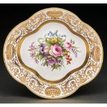 A Copeland bone china dessert dish, 1932, painted with flowers in wide gilt border of urns and