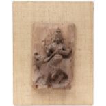 A South Indian carved wood relief of a deity riding on a elephant, 19th c, 30 x 19cm, backed on