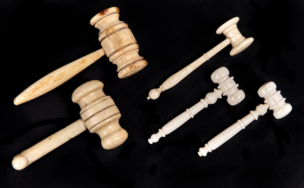Five bone auctioneer's gavels, late 19th and early 20th c,  the handle of one carved with a leaf,
