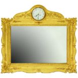 A French giltwood and composition picture frame, crested by a clock, c1900, the clock with enamel