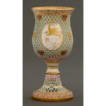 A Royal Worcester honeycomb reticulated and jewelled goblet, 1876, with raised gilt medallions of