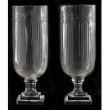 A pair of cut glass storm shades, 20th c, on stepped square foot, 40cm h Good condition