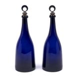 A pair of cobalt blue glass taper decanters, early 19th c, sharp pontil scar, 27.5cm h excluding