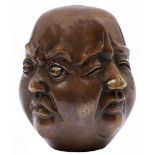 A South East Asian bronze patinated brass four faced sculpture of the head of a man, 20th c,  20cm h