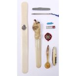 A Victorian ivory letter knife,  30.5cm l, a 1920s celluloid letter knife in the form of a lion, etc