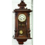 A walnut Vienna wall clock with enamel dial, c1930, 78 x 32cm Minor scuffs and scratches and