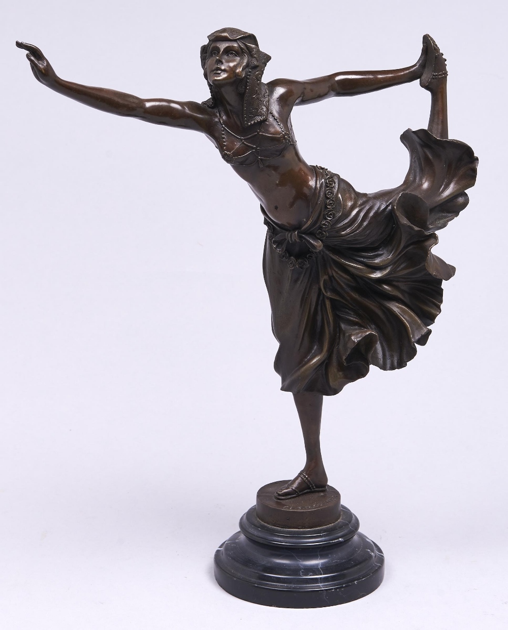 A bronze statuette of an Egyptian dancer cast from a model by Claire Jeanne Roberte Colinet, rich