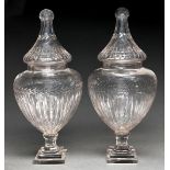 A pair of shield shaped cut glass vases and covers, 20th c, on stepped square foot, 54cm h Good