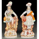 A pair of Staffordshire flatback figures of Highlanders with sheep, 19th c, 25.5cm h Both in good