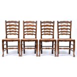 A set of four stained ash ladder back chairs, 19th c style, rush seated, seat height 45cm Handling