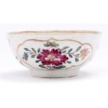 A Worcester famille rose slop bowl, c1775, enamelled with flowers in gilt reserves, 12.5cm diam Wear
