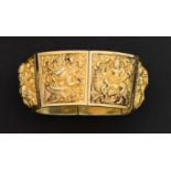 An Indian silver gilt repousse bracelet, c1880 of six curved, tapered high relief repousse panels of