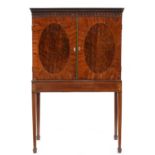 A George III mahogany collector's cabinet, crossbanded and line inlaid, with pear drop frieze and