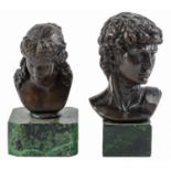 A bronze sculpture of the head of Antonius and another, 20th c, on faux marble base, 17cm h and