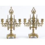 A pair of Victorian brass gothic twin branch candelabra, c1870, spire and pierced trefoil finial,