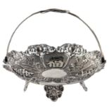 A Chinese silver basket, c1910, with looped wirework handle,  applied with flowers and shou