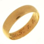 A gold wedding ring, engraved with initials and date 1910, marked 585, 4g, size P Light wear