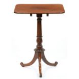 A mahogany tripod table, the plum pudding mahogany tip-up top on turned pillar with associated