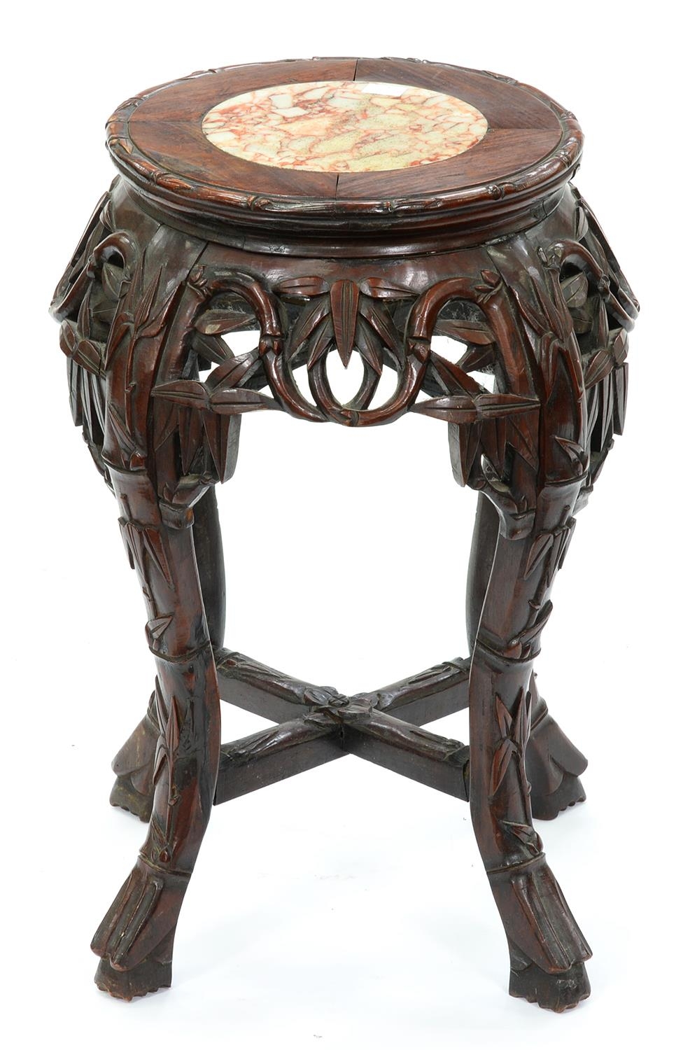 A Chinese hardwood stand, first half 20th c, with marble inset top and carved with bamboo, 48cm h,