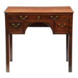 A George III mahogany lowboy, with moulded top and fitted three cockbeaded drawers to the arched