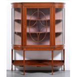 An Edwardian mahogany china cabinet, crossbanded in rosewood and line inlaid, the door with oval