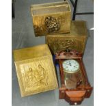 Two embossed brass covered wood fireside boxes, a magazine rack and a wall clock, 20th c Good