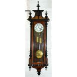 An ebonised and walnut Vienna wall clock, late 19th c, architectural pediment with spire finials,