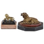 A gilt brass inkwell in the form of a dog, late 19th c, on marble and slate base, 10cm l and a