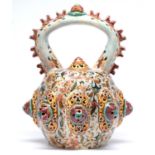 A Zsolnay reticulated and arch handled vessel and stopper, late 19th c, applied with turquoise,