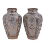 A pair of Middle Eastern silver coloured metal repousse vases, early 20th c, shouldered oviform