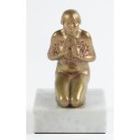 A French art deco gilt bronze statuette, the stylish kneeling young woman naked but for earrings and
