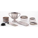 Miscellaneous small silver articles, to include a miniature trophy cup, 63mm, London 1928, a
